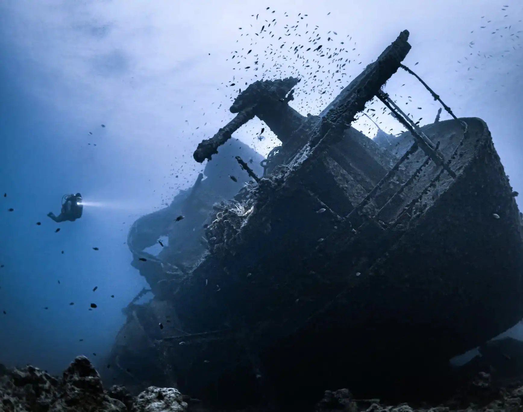 Scuba divers approaching a wreck off the Dorset coast